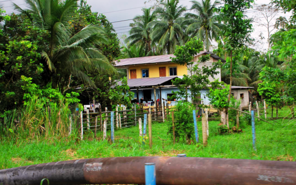 house with an oil pipe in front